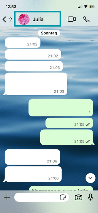 An WhatsApp chat on iOS, with the name of the participant on the other end highlighted.